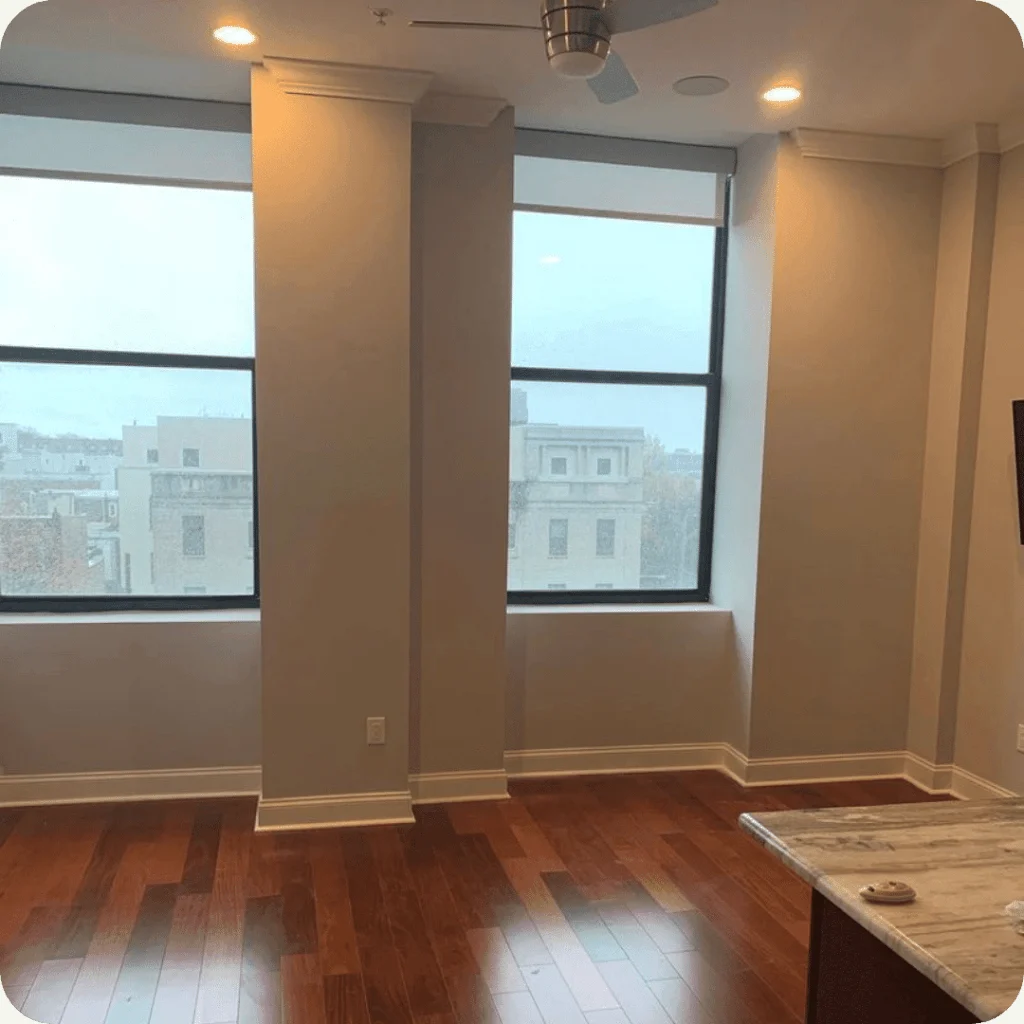 Zephyr interior work with light painted walls, white window trim, and hardwood flooring