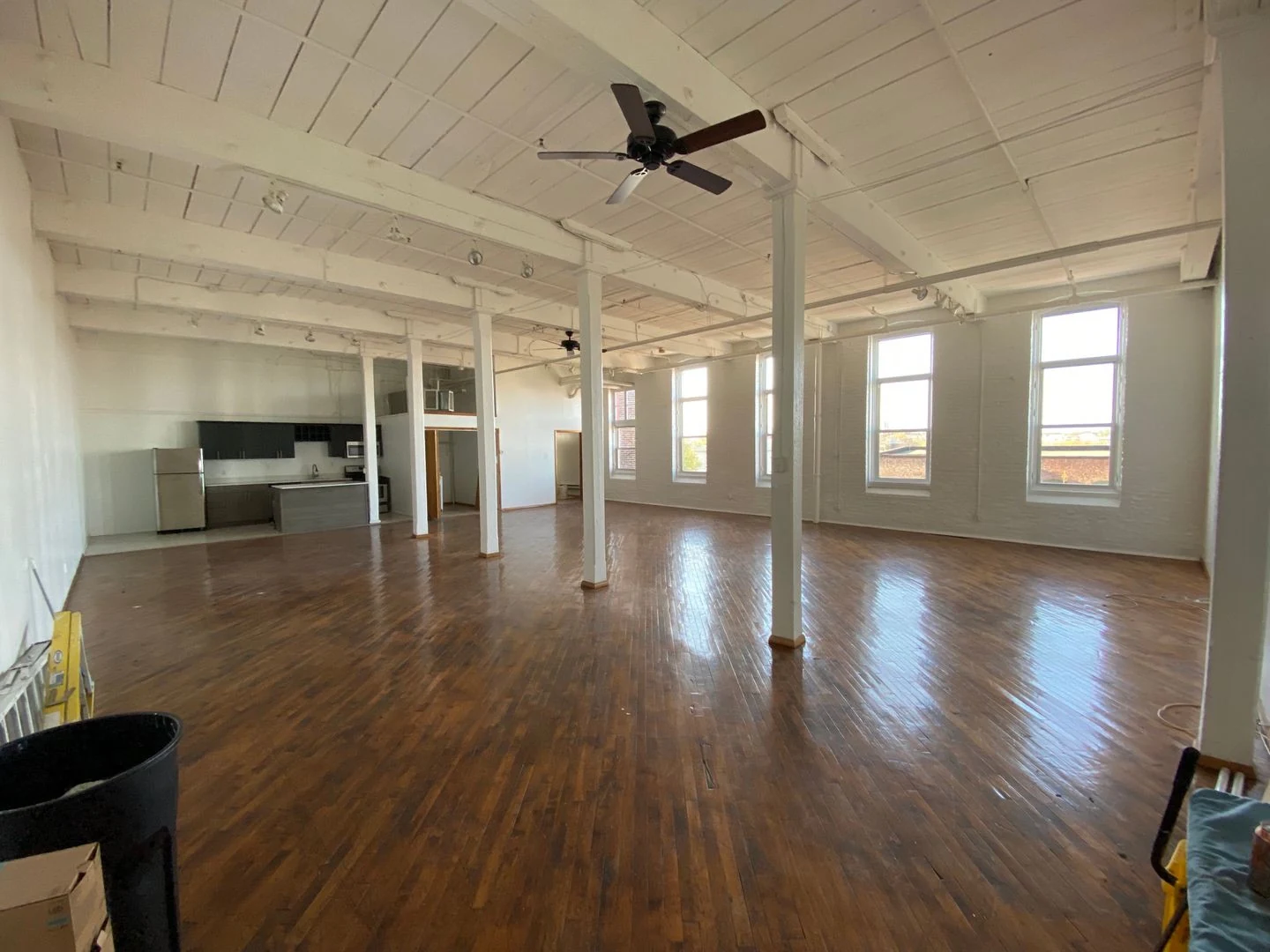 Zephyr interior work with light painted walls, white window trim, and hardwood flooring